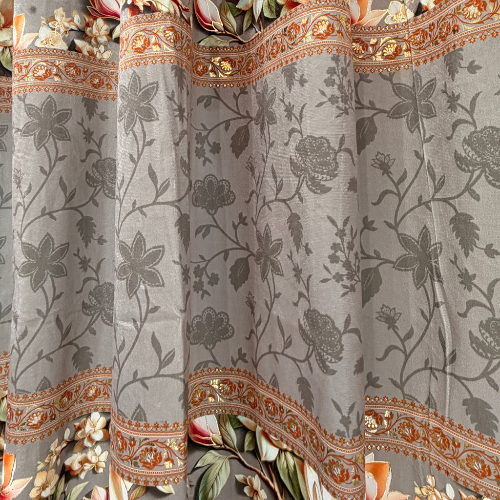 Decorative fabric with floral and paisley patterns on a gray background